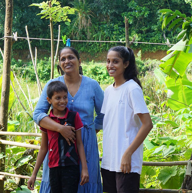 Shamila and her children next to their vegetable plot, outside their home in the Matara District. | Photo: Nashali Silva/Save the Children